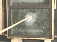 Wood 2X4 breaking glass