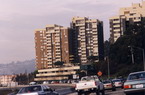A busy freeway next to apartment buildings