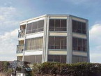 Photo of a building with large windows.